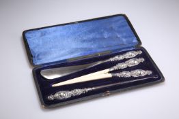 A VICTORIAN SILVER-HANDLED SHOE-HORN, GLOVE-STRETCHER AND BUTTON-HOOK SET