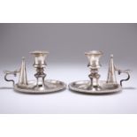 A PAIR OF GEORGE IV SILVER CHAMBERSTICKS