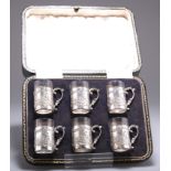 A SET OF SIX GEORGE V SILVER TOT CUPS