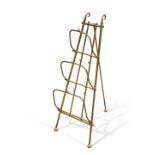 AN EDWARDIAN BRASS THREE DIVISION COLLAPSIBLE NEWSPAPER RACK