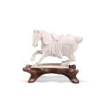 A CHINESE IVORY CARVING OF A HORSE, 19TH CENTURY