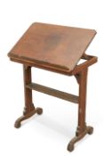 A 19TH CENTURY OAK ADJUSTABLE READING STAND