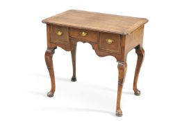 AN 18TH CENTURY FEATHERBANDED WALNUT LOWBOY