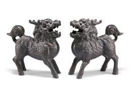 A PAIR OF CHINESE BRONZE MODELS OF QILIN