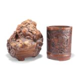 A CHINESE ROOT WOOD CARVING AND A BAMBOO BRUSH POT