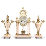 A LATE 19TH CENTURY FRENCH GILT-BRASS AND ONYX CLOCK GARNITURE