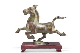AFTER THE ANTIQUE, A CHINESE BRONZE OF A PRANCING HORSE