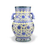 A CHINESE BLUE AND WHITE YELLOW-GROUND TWO-HANDLED VASE, HU