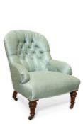 A VICTORIAN MAHOGANY AND DEEP BUTTONED COUNTRY HOUSE ARMCHAIR