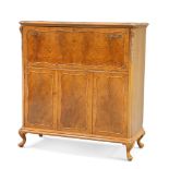 A WALNUT DRINKS CABINET, 20TH CENTURY