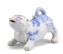A JAPANESE HIRADO BLUE AND WHITE MODEL OF A DOG, MEIJI PERIOD