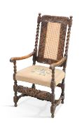 A CAROLEAN STYLE OAK OPEN ARMCHAIR, 19TH CENTURY