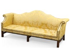 A GEORGE III STYLE MAHOGANY AND UPHOLSTERED SETTEE