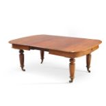 A VICTORIAN MAHOGANY WIND-OUT EXTENDING DINING TABLE