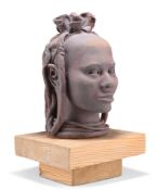 AN AFRICAN TERRACOTTA SCULPTURE OF A FEMALE HEAD