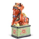 A CHINESE CLOBBERED MODEL OF A FOO DOG