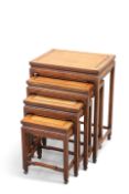 A SET OF FOUR CHINESE HARDWOOD NESTING TABLES