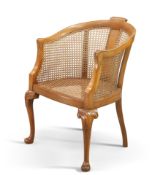 AN EARLY 20TH CENTURY BERGÈRE TUB CHAIR