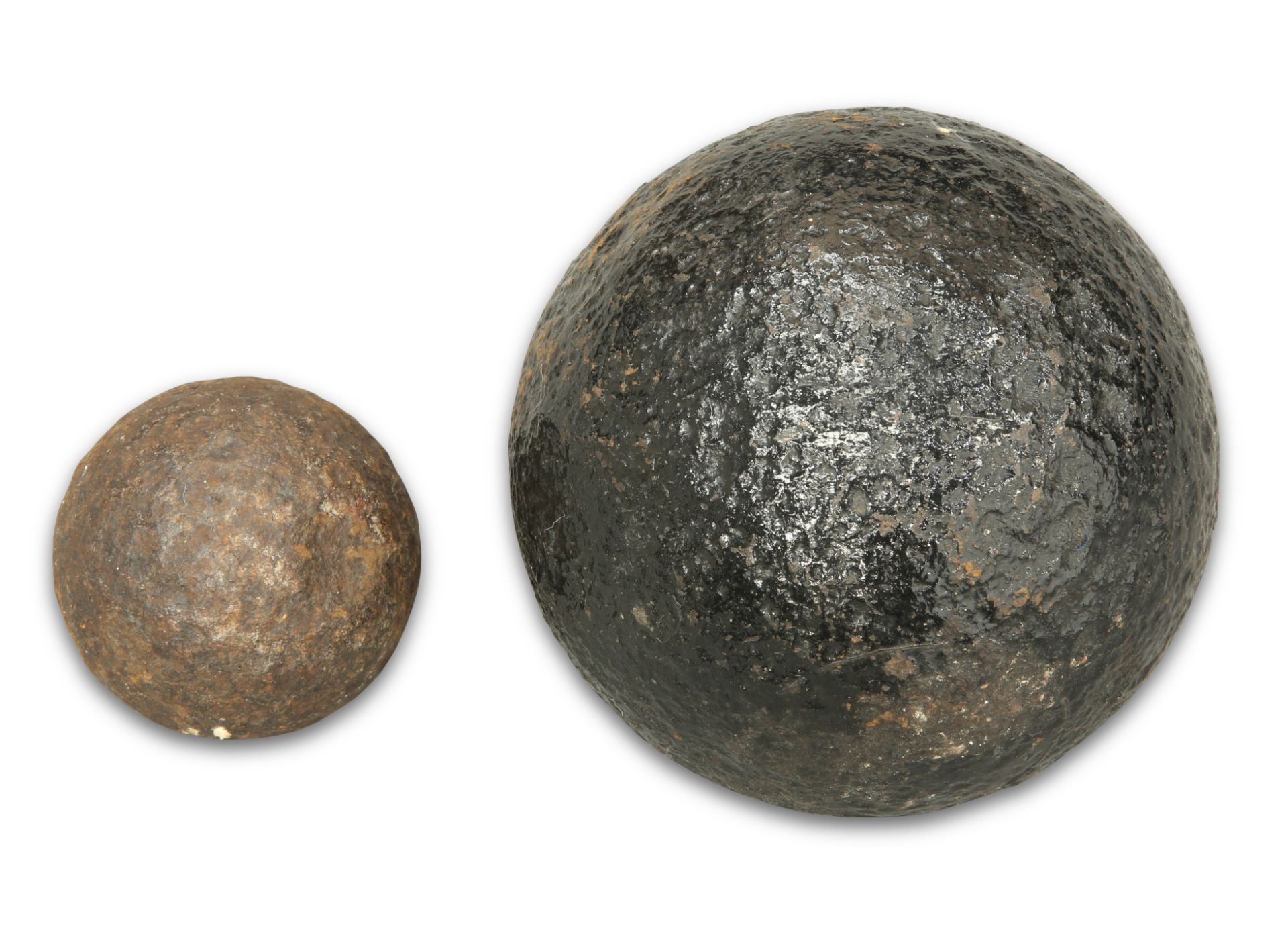 TWO ANTIQUE IRON CANNON BALLS