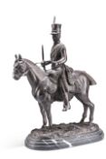 A PATINATED BRONZE GROUP OF A FRENCH HUSSAR ON HORSEBACK