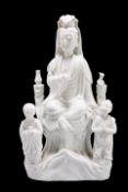 A CHINESE BLANC DE CHINE MODEL OF A GUANYIN