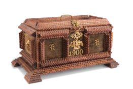 AN EARLY 20TH CENTURY TRAMP ART CASKET