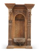 A VICTORIAN CARVED OAK VASE STAND