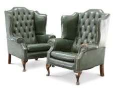 A PAIR OF GREEN LEATHER BUTTON-BACK WING-BACK ARMCHAIRS