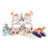 A COLLECTION OF STAFFORDSHIRE POTTERY DOG MODELS