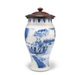 A CHINESE TRANSITIONAL STYLE BLUE AND WHITE VASE