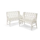 A PAIR OF WHITE PAINTED METAL "GOTHIC" GARDEN BENCHES