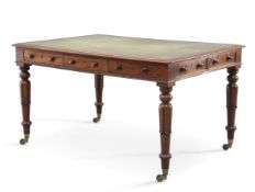 AN EARLY VICTORIAN LEATHER-INSET MAHOGANY LIBRARY TABLE