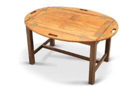 A BRASS-MOUNTED TEAK BUTLERS TRAY COFFEE TABLE