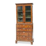 AN EARLY 18TH CENTURY WALNUT CABINET ON CHEST