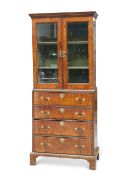 AN EARLY 18TH CENTURY WALNUT CABINET ON CHEST