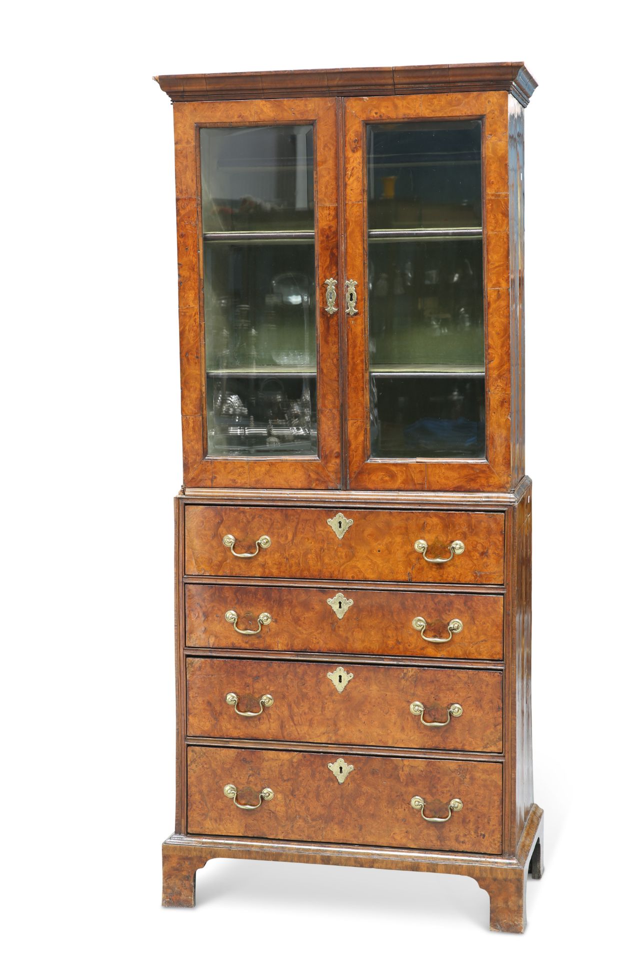 AN EARLY 18TH CENTURY WALNUT CABINET ON CHEST