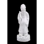 A CHINESE BLANC DE CHINE FIGURE OF A SCHOLAR