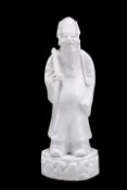A CHINESE BLANC DE CHINE FIGURE OF A SCHOLAR
