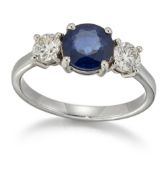 A SAPPHIRE AND DIAMOND THREE STONE RING