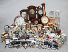 A LARGE COLLECTION OF CLOCKS AND WATCHES FROM A WATCH REPAIR SHOP