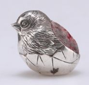 AN EDWARDIAN SILVER-MOUNTED NOVELTY PINCUSHION