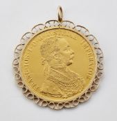 AN AUSTRIAN 4 DUCAT RESTRIKE COIN, MOUNTED IN A 9 CARAT SCROLL FRAME AS A PENDANT