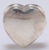 AN ELIZABETH II SMALL SILVER HEART-SHAPED BOX