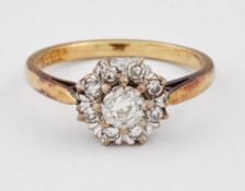 AN 18 CARAT GOLD DIAMOND CLUSTER RING