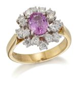 AN 18 CARAT GOLD PINK SAPPHIRE AND DIAMOND CLUSTER RING