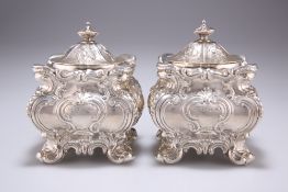 A GOOD PAIR OF BAROQUE REVIVAL SILVER CADDIES