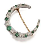 A 9 CARAT BI-COLOUR GOLD EMERALD AND DIAMOND CRESCENT BROOCH