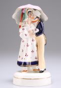 A STAFFORDSHIRE PORCELLANEOUS FIGUR, "UMBRELLA COURTSHIP"