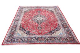 A FINELY WOVEN PERSIAN MASHAD CARPET