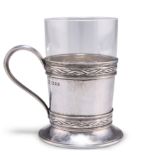 AN ARTS AND CRAFTS SILVER TEA GLASS HOLDER